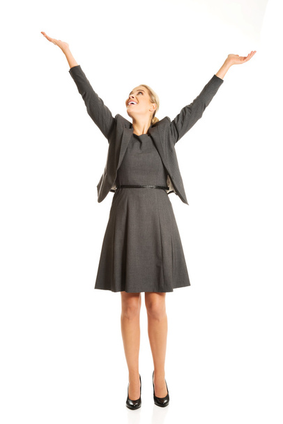 Woman raising arms high - Фото, зображення