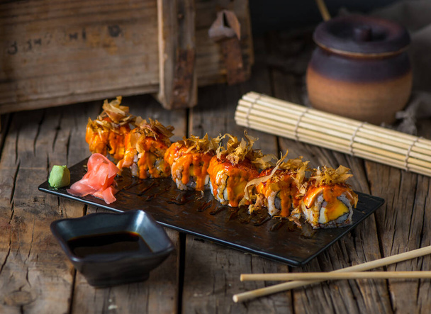 HANAKO maki served in a dish isolated on wooden background side view - Valokuva, kuva