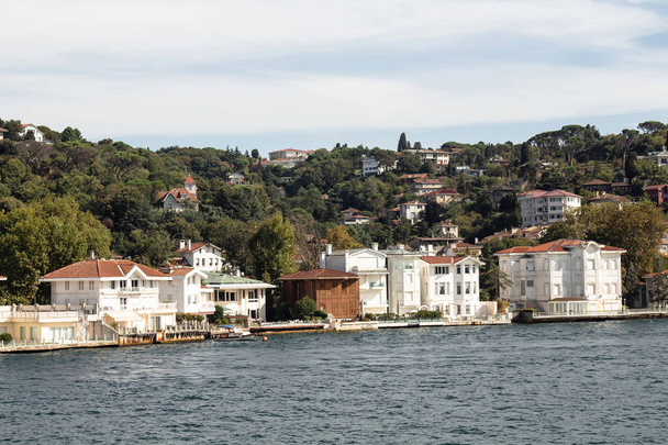 View of historical, traditional mansions by Bosphorus in Kanlica area of Asian side of Istanbul. It is a sunny summer day. Beautiful travel scene. - Zdjęcie, obraz