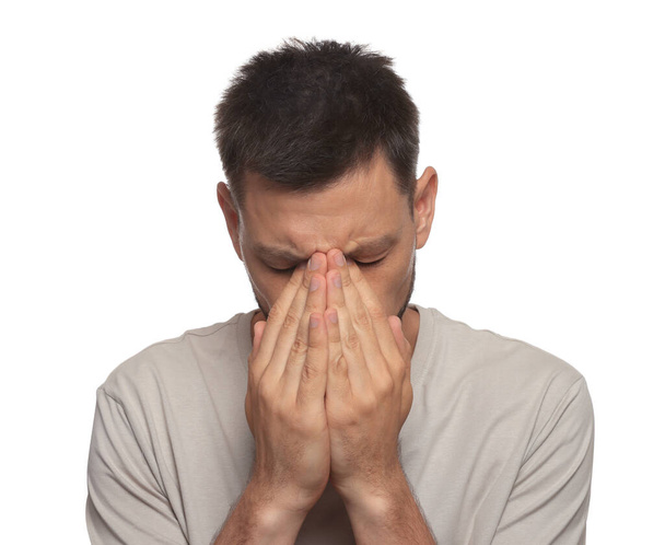Man suffering from eyestrain on white background - Photo, Image