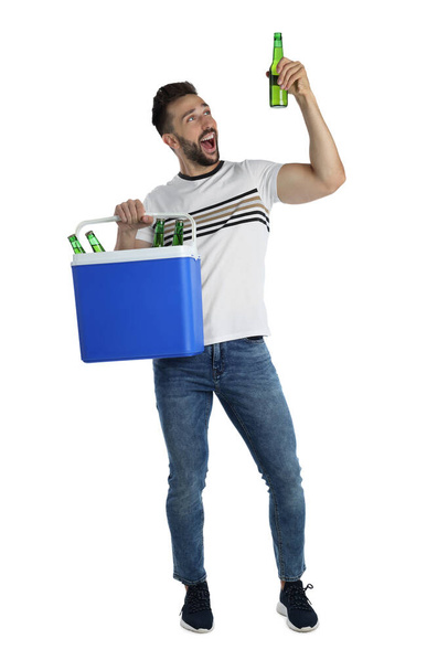 Happy man with cool box and bottles of beer on white background - Foto, immagini