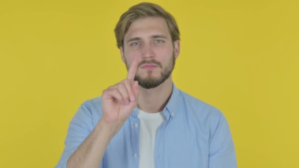 Casual Young Man in Denial on Yellow Background  - Materiaali, video
