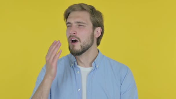 Tired Casual Young Man Yawning on Yellow Background  - Video