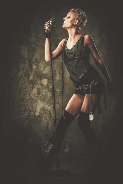 Steam punk singer with microphone - Photo, Image