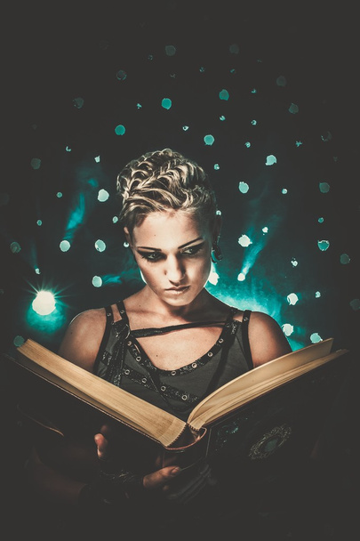 Steampunk girl with a book - 写真・画像