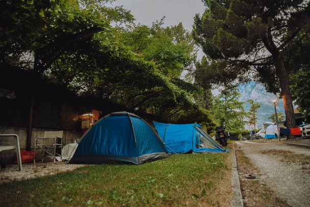 Camping in the forest, tent city, travel by car or with tents. Leisure and vacation - Φωτογραφία, εικόνα