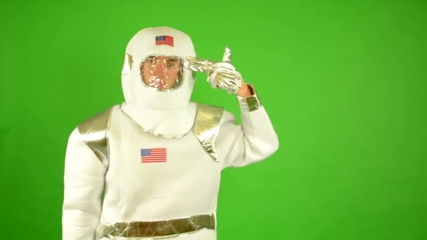 Concept: astronaut shoot himself - green screen - Footage, Video