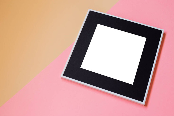 White picture frame with decorations. Mock up for your photo or text. Place your work, print art, white background, pastel color book. Photo realistic 3d illustration. Pink and orange background - Foto, Bild