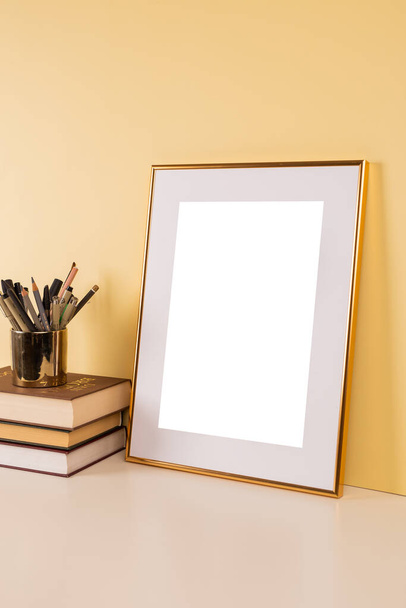 Gold picture frame with decorations. Mock up for your photo or text. Place your work, print art, white background, pastel color book. Photo realistic 3d illustration - Foto, imagen