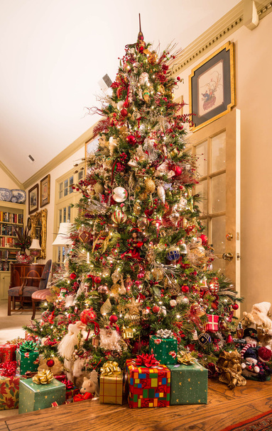 Presents Under Decorated Christmas Tree in Den - Photo, Image
