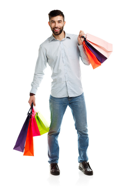 Man holding shopping bags. Christmas and holidays concept - Foto, immagini
