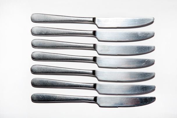 Cutlery, forks, knives, dispenser for salt and pepper, spoons, glasses, wine glasses, saucers, sugar dispenser - Photo, Image