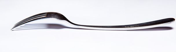 Cutlery, forks, knives, dispenser for salt and pepper, spoons, glasses, wine glasses, saucers, sugar dispenser - Фото, зображення