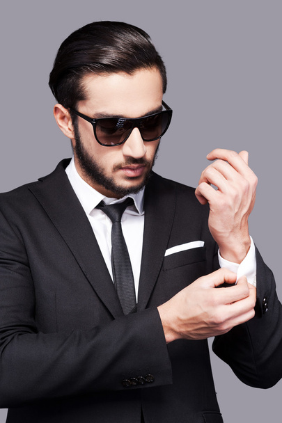 Man in formalwear adjusting his sleeves - Фото, изображение
