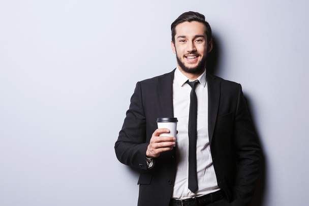 Man in formalwear holding cup of coffee - Photo, Image