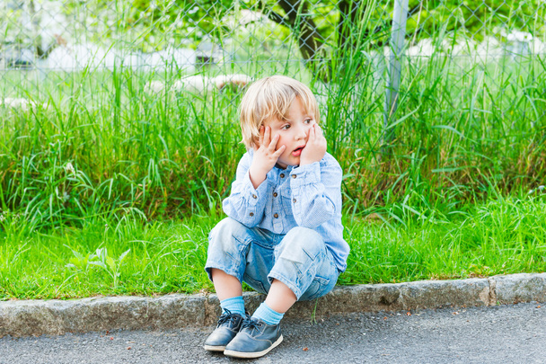 Outdoor portrait of a cute toddler boy on a nice summer day - Photo, Image