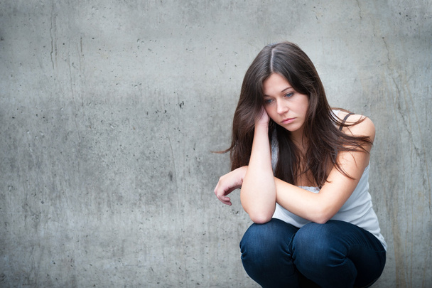 Teenage girl looking thoughtful about troubles  - Фото, зображення