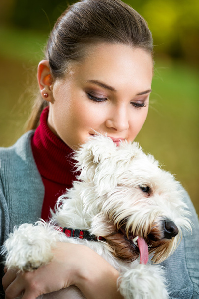 Portrait of girl with her dog - Фото, изображение