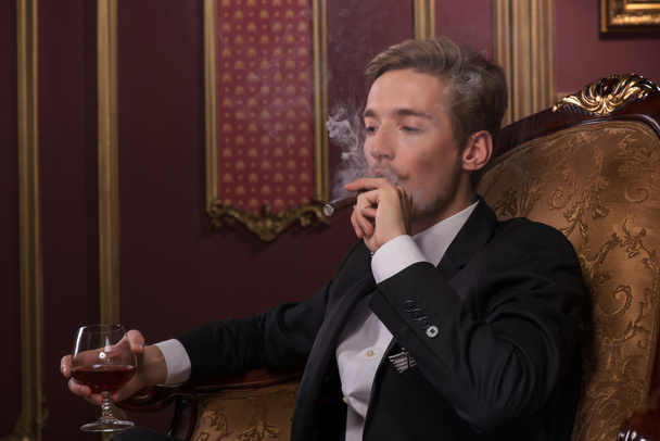 Handsome man with cigar - 写真・画像