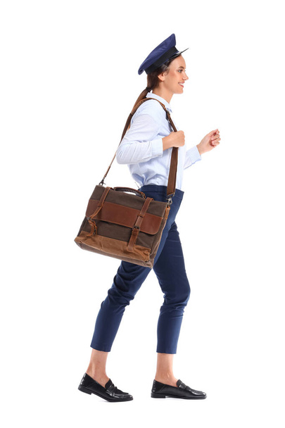 Young postwoman with bag on white background - Foto, Imagem