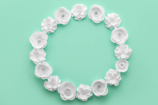 Frame made of beautiful origami flowers on color background - Φωτογραφία, εικόνα