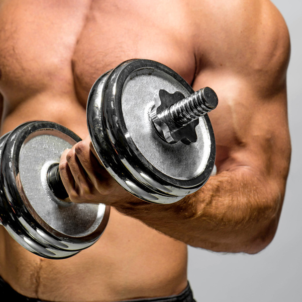 Guy with dumbbell - Photo, image
