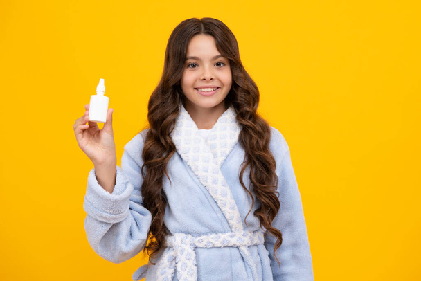 Runny nose. Teenager girl use nasal drops spray. Allergy, healthy child hold nasal drops - Φωτογραφία, εικόνα