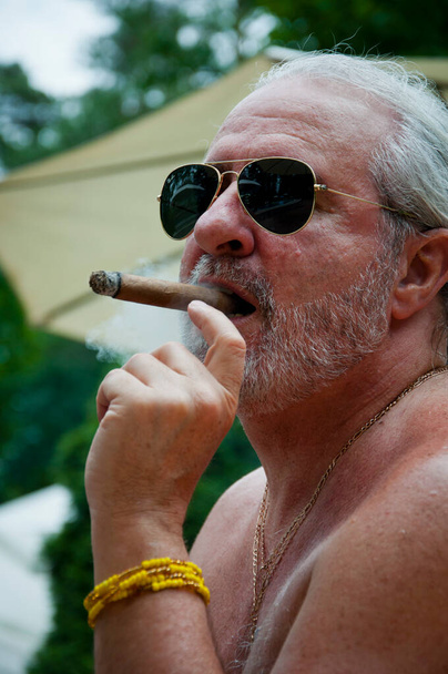 senior brutal man smoking, brutal man smoking cigar. brutality. - Photo, Image