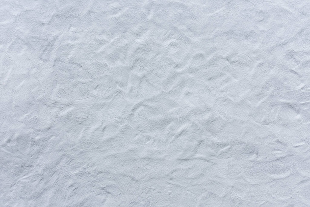 corrugated plaster from a white wall of an old castle - Foto, afbeelding