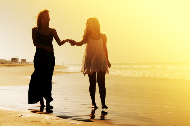 Girlfriends walking at beach - Photo, Image