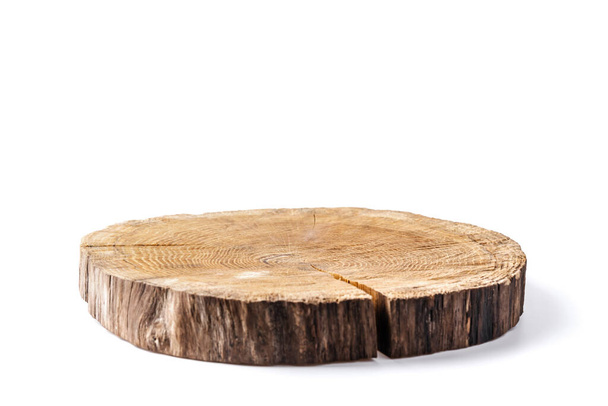 Wooden plate carved from tree trunk isolated on white background. Can be used like stand for your object - Foto, Imagem