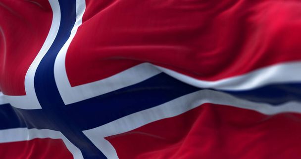 Close-up view of the Norway national flag waving in the wind. Norway is a Nordic country in Northern Europe - 写真・画像