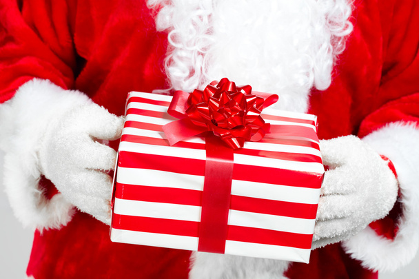 Hands of Santa Claus with gift - Foto, Bild