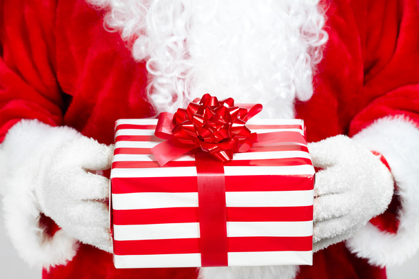 Hands of Santa Claus with gift - Photo, Image