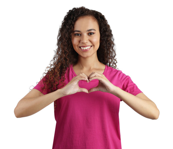 Happy young African-American woman making heart with hands on white background - Foto, Imagem