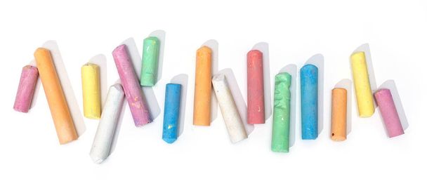 Variety of colored chalk sticks isolated on white background - Photo, Image