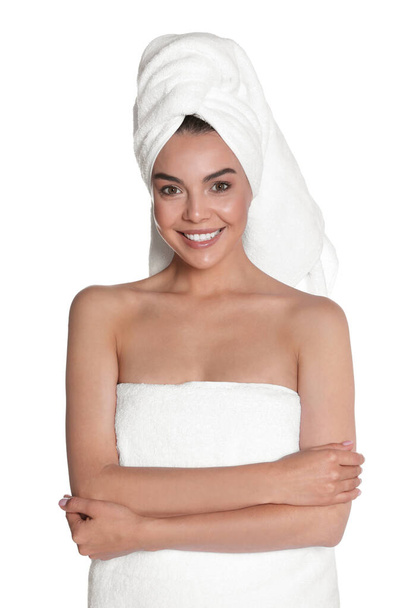Beautiful young woman with towels on white background - Fotó, kép