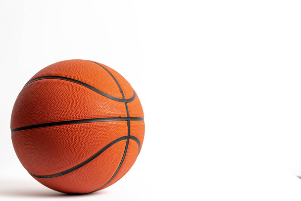Orange basketball on a plain white background - Fotó, kép