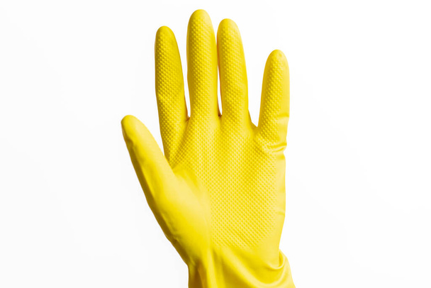 Yellow cleaning gloves for the home on a white background - Фото, изображение