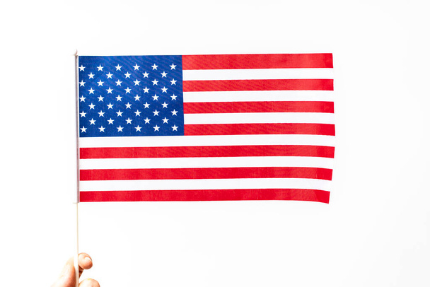 Person holding the american flag representing the usa - 写真・画像