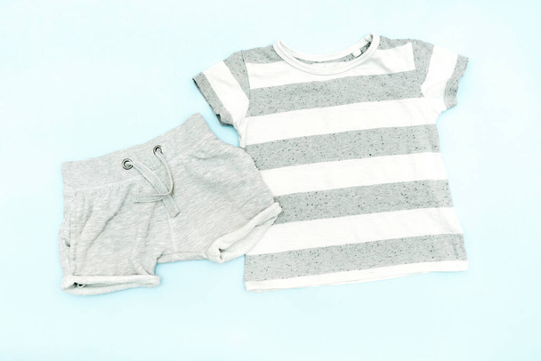 Summer babies gray clothes and accessories with t shirt, shorts. Modern fashion kids casual outfit.Set of children's clothing for spring. Flat lay, top view,overhead,mockup. - Photo, Image