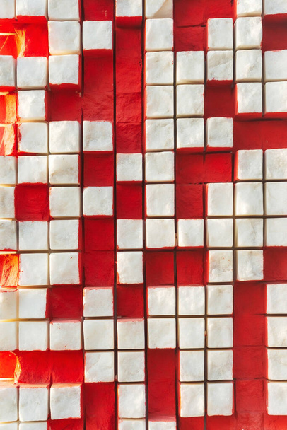 texture from white marble cubes. white squares on a red background. marble texture - Fotografie, Obrázek
