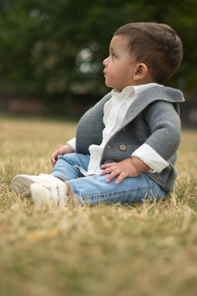 11 Months old Cute Baby is Enjoying and Posing to Camera at Park of Luton England UK - Фото, изображение