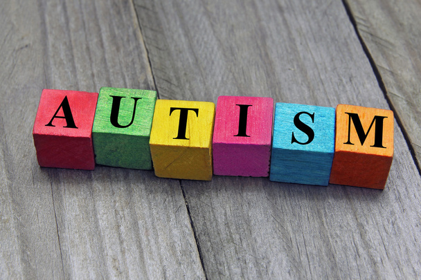 Concept of autism word on wooden cubes - Photo, Image