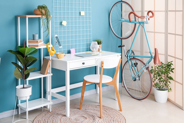 Interior of stylish office with workplace and bicycle - Foto, Imagem