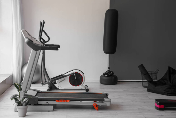 Interior of modern gym with treadmill and sport equipment - Fotoğraf, Görsel