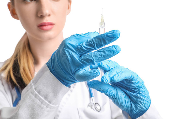 Doctor with syringe on white background, closeup - Fotografie, Obrázek