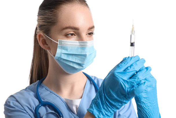 Doctor with syringe on white background - Zdjęcie, obraz