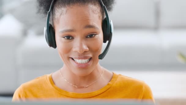 Happy, helpful and trendy female call center agent talking on a headset while remote working at home. Confident and friendly woman explaining solutions and assisting customers with service or support. - Video, Çekim