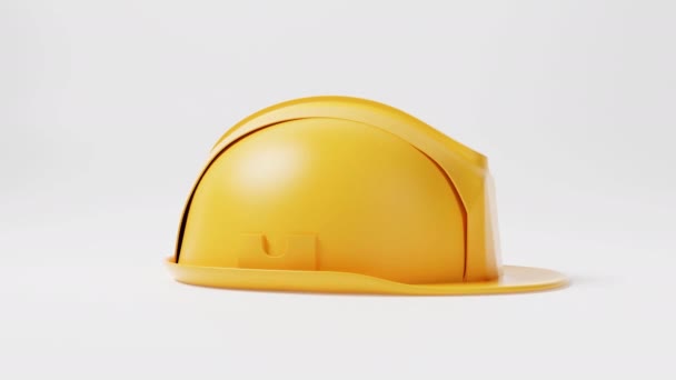 Saumaton silmukka keltainen kypärä rakentaminen kypärä liike pyörii 360 asteen kulmassa valkoisella pohjalla. Liiketoiminnan ja teollisuuden turvallisuuden käsite - Materiaali, video